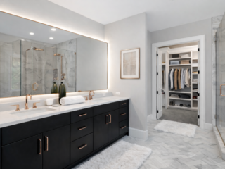 Luxury bathroom remodel in Tampa Bay with double vanity and frameless glass shower