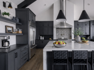 Modern black kitchen remodeling with custom cabinetry, waterfall island, and design-build craftsmanship in Tampa Bay.