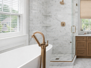 Custom shower and freestanding tub bathroom remodel in Tampa Bay with frameless glass enclosure