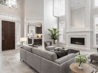 Full-home remodeling project in Tampa Bay featuring open living room, fireplace, high ceilings, and integrated kitchen design