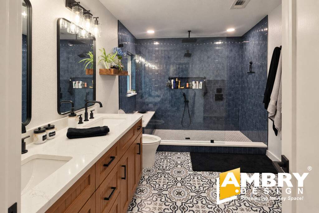 Bathroom remodel by Ambry Design with black tile shower and double vanity