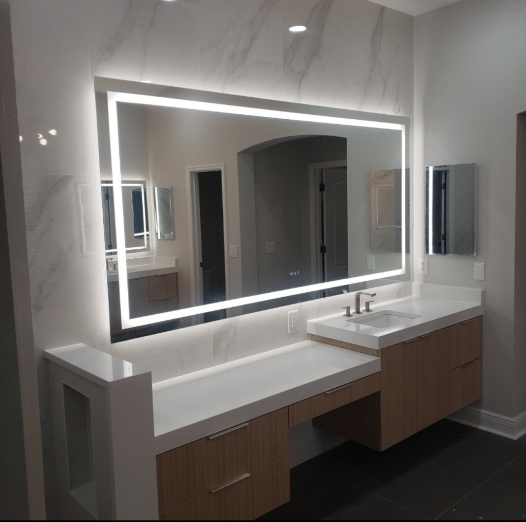 Bathroom remodel by Ambry Design with lighted mirror vanity