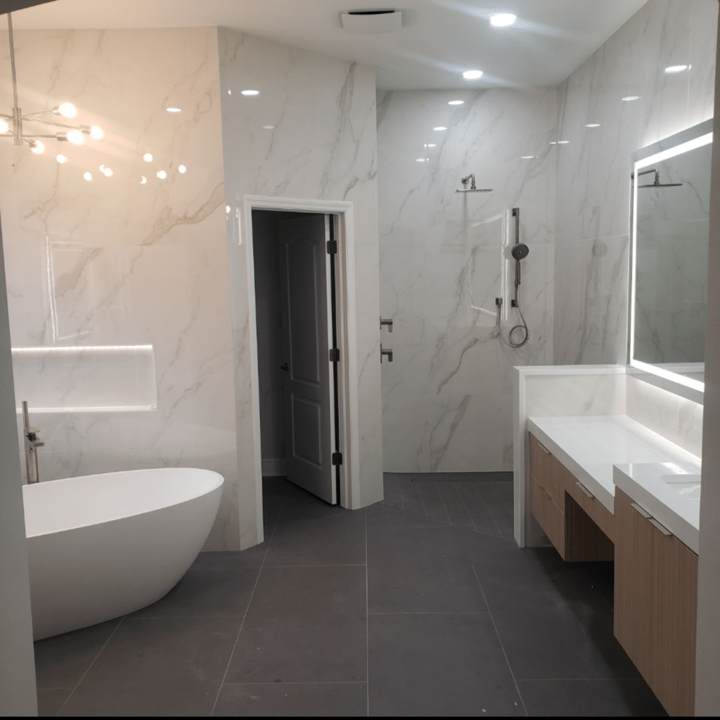 Bathroom remodel by Ambry Design with marble-look tile shower