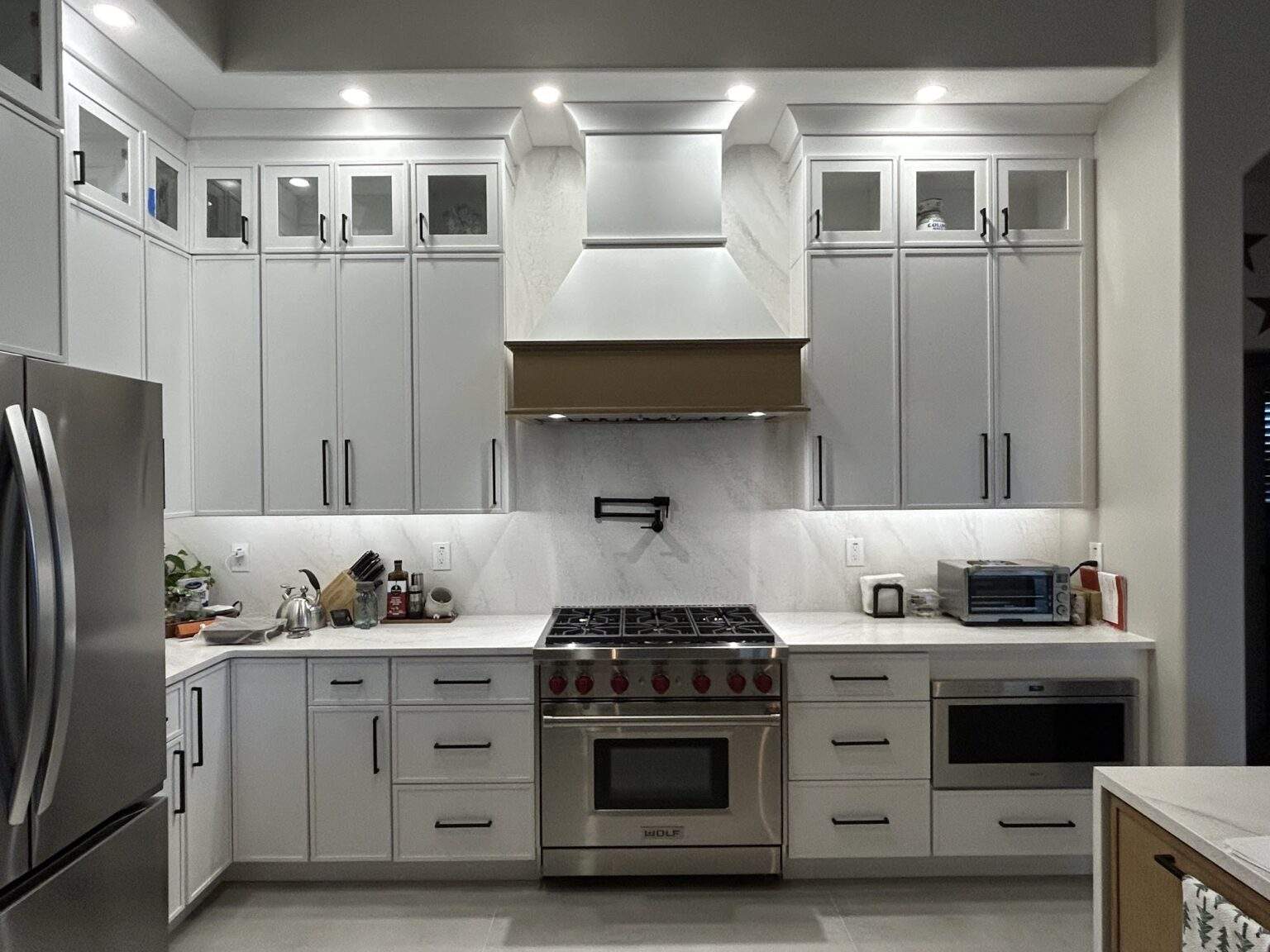 Kitchen range hood 1 (Kyle Erickson) - Ambrydesign.com Kitchen remodel by Ambry Design with custom range hood and gray cabinets